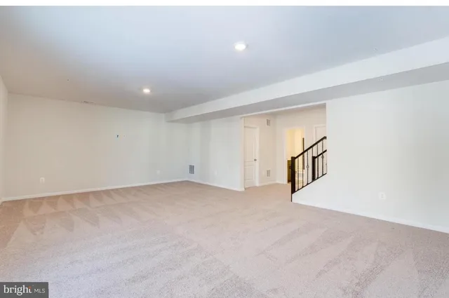 an empty room with staircase