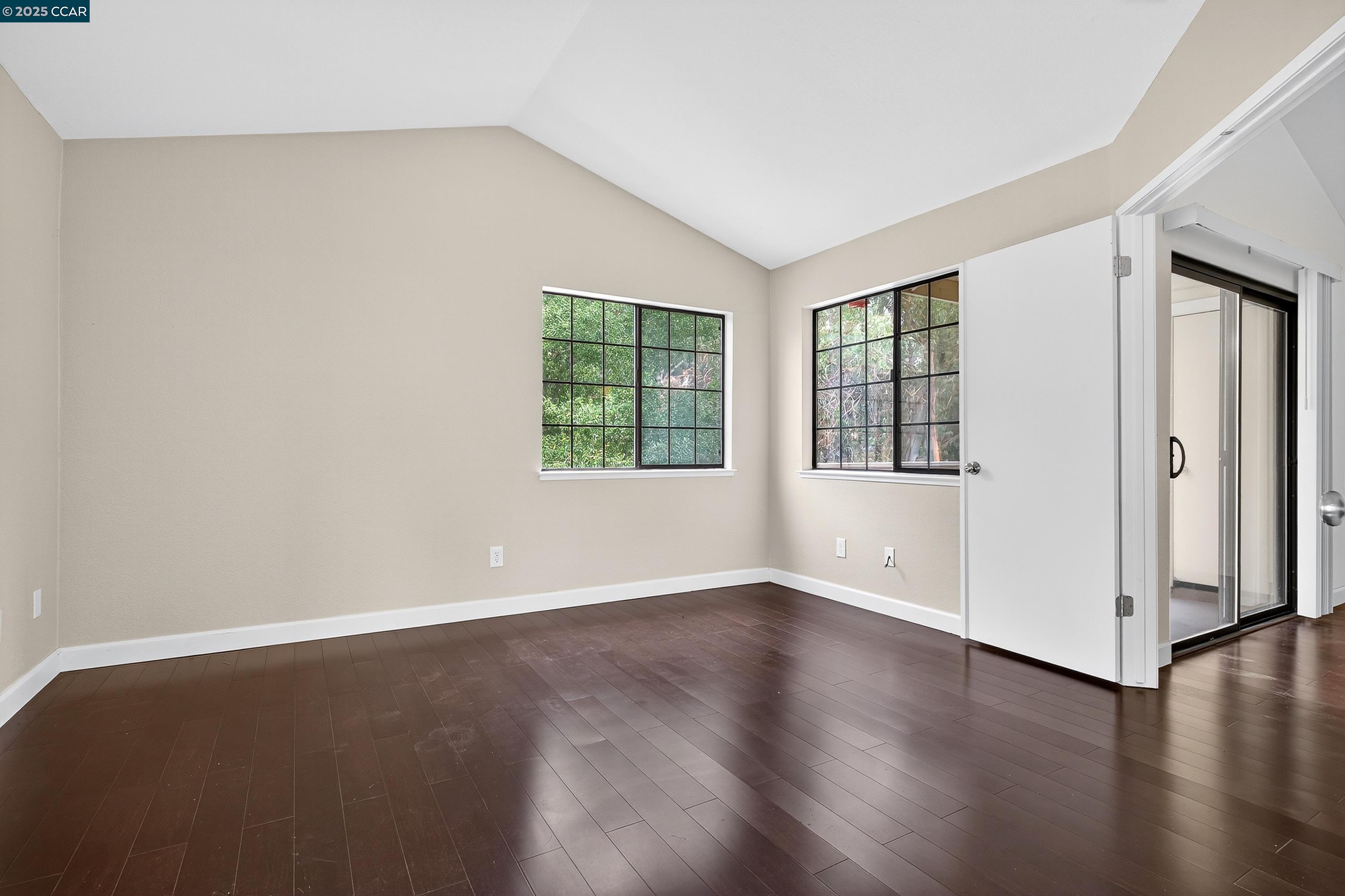 1202 Devonwood Hercules, CA 94547 - Photo 20 of 46 an empty room with wooden floor and windows
