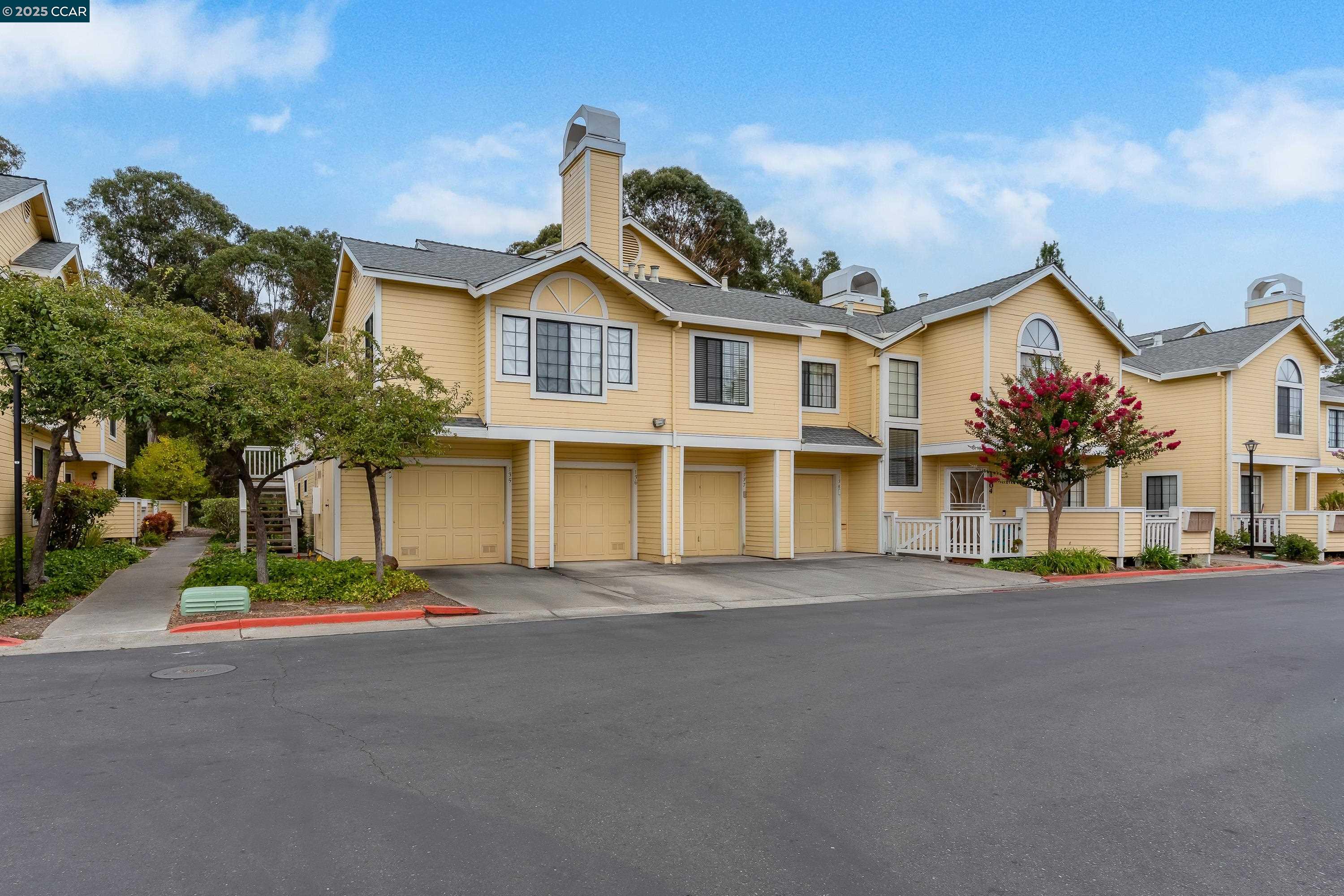 1202 Devonwood Hercules, CA 94547 - Photo 2 of 46 a front view of a house with a yard and garage