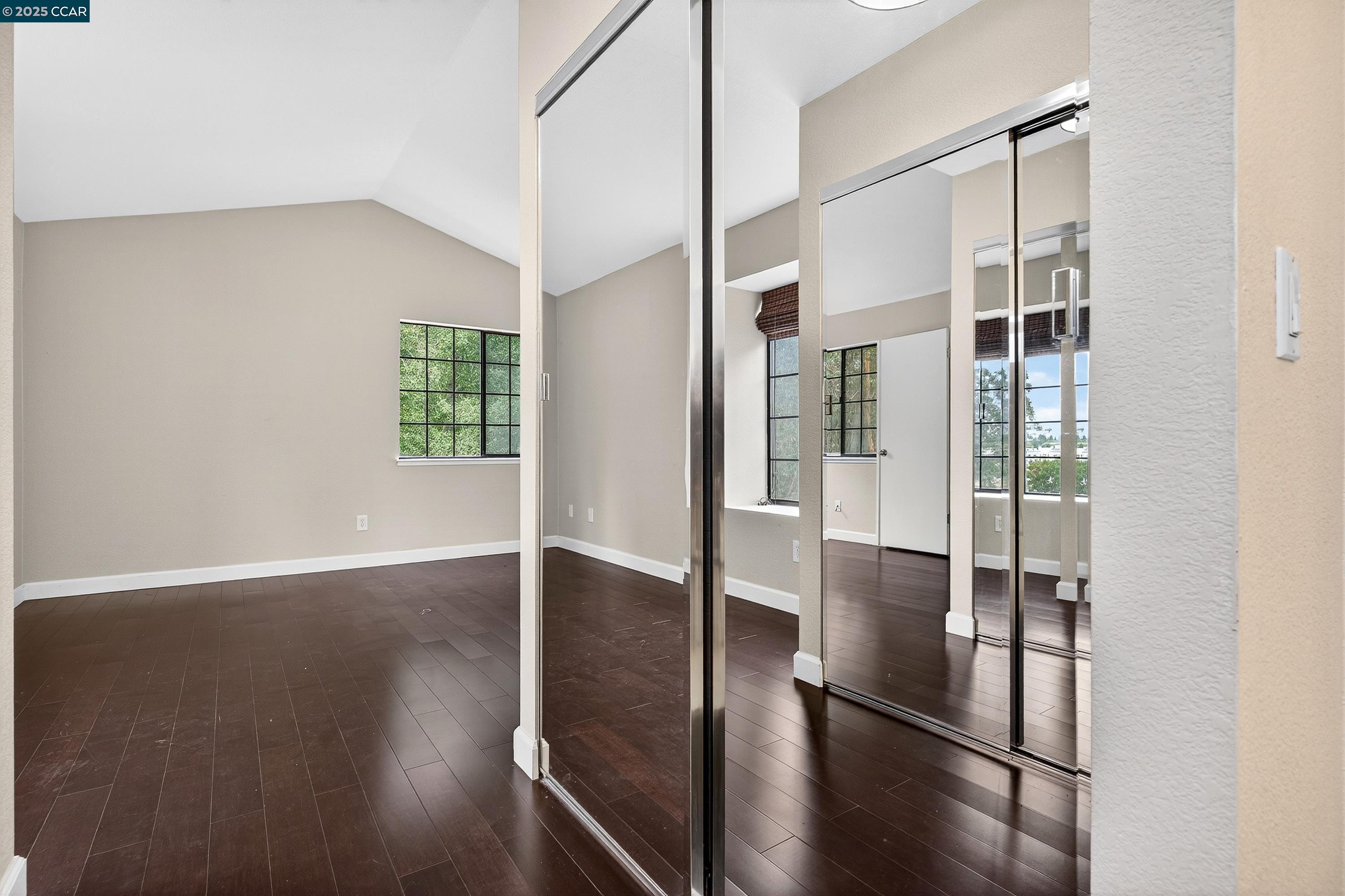 1202 Devonwood Hercules, CA 94547 - Photo 24 of 46 an empty room with wooden floor and windows