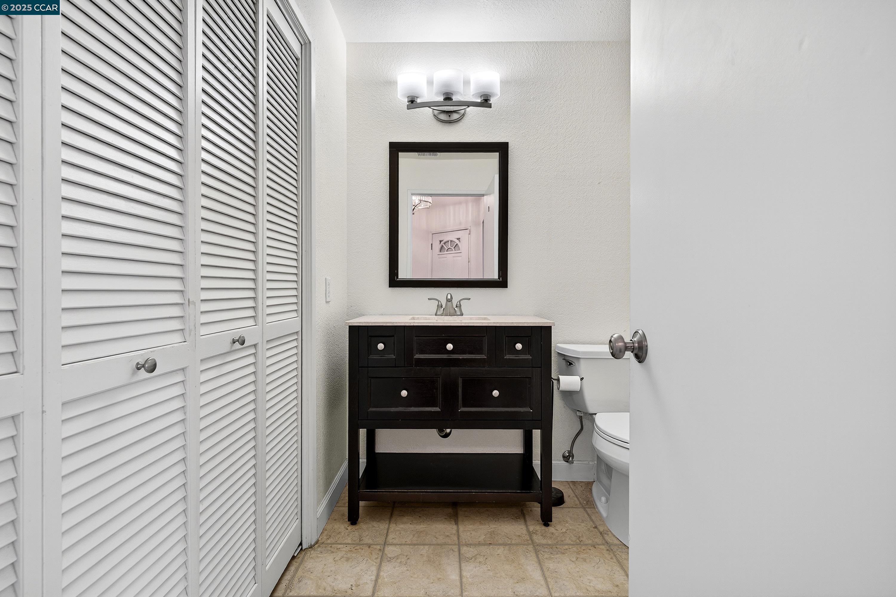 1202 Devonwood Hercules, CA 94547 - Photo 34 of 46 a bathroom with a sink and a mirror