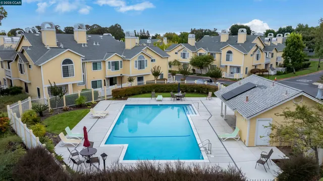 a view of multiple houses with a yard