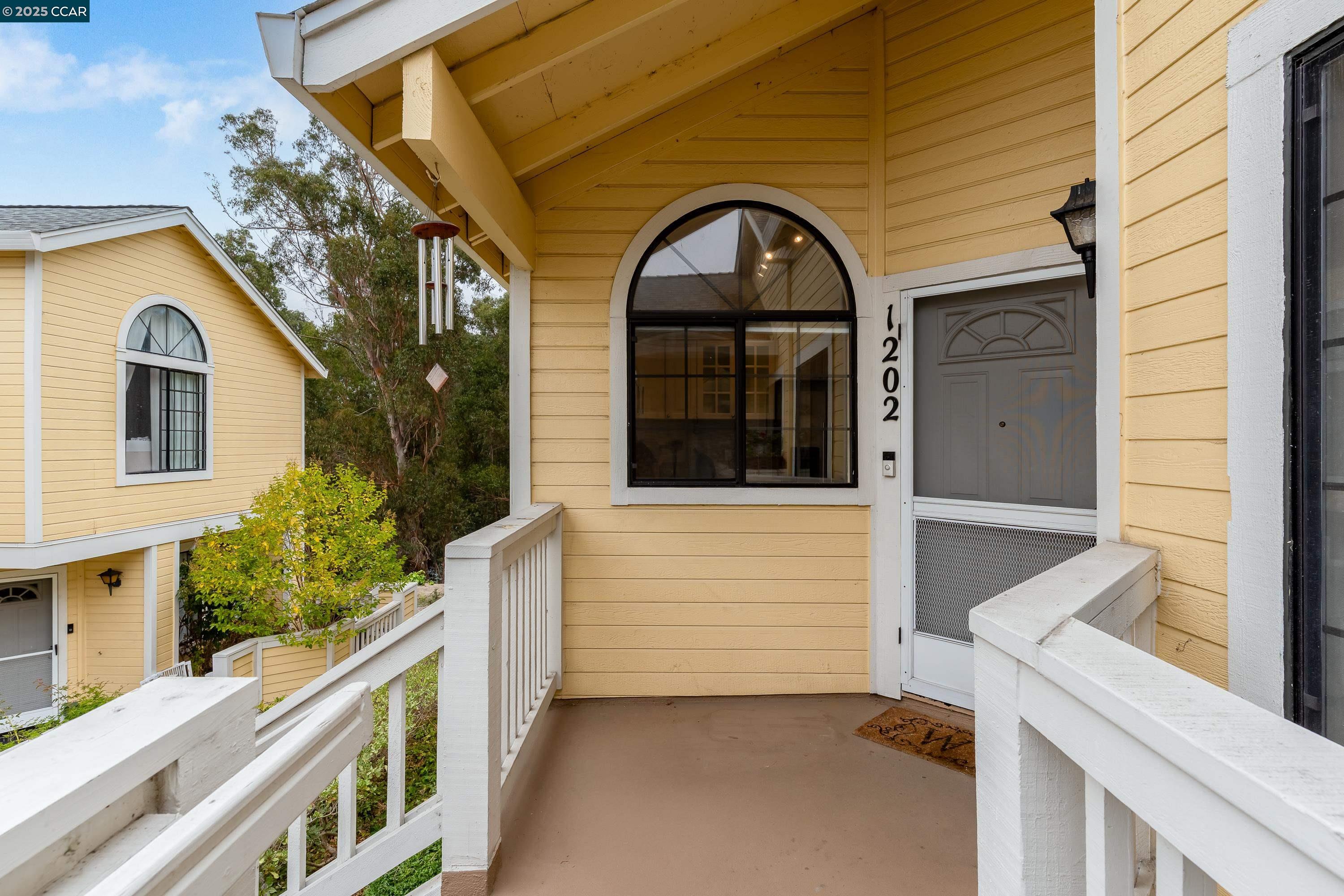 1202 Devonwood Hercules, CA 94547 - Photo 4 of 46 a view of a brick house with large windows