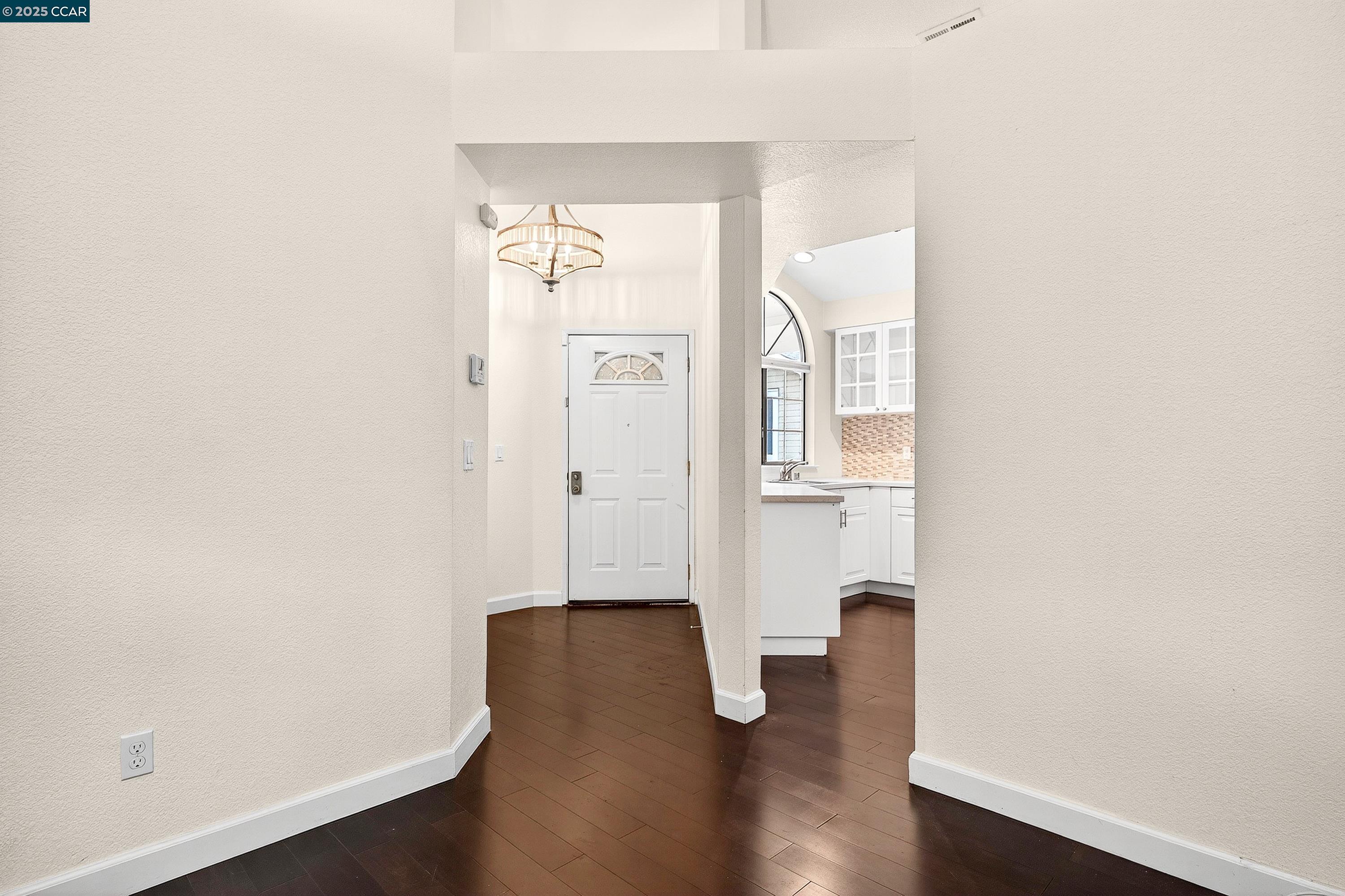 1202 Devonwood Hercules, CA 94547 - Photo 5 of 46 an empty room with wooden floor and mirror