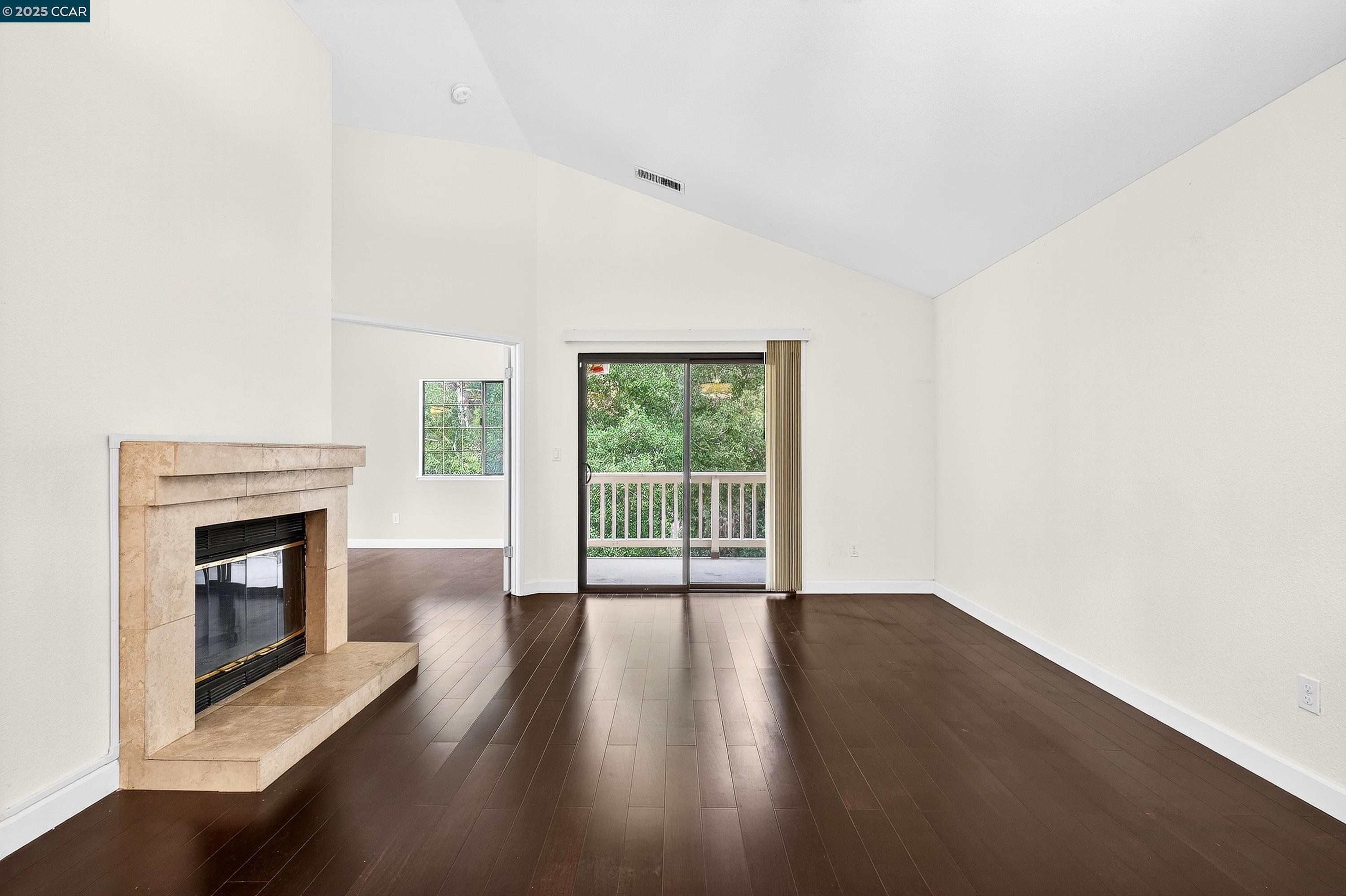 1202 Devonwood Hercules, CA 94547 - Photo 10 of 46 a view of empty room with wooden floor and fireplace