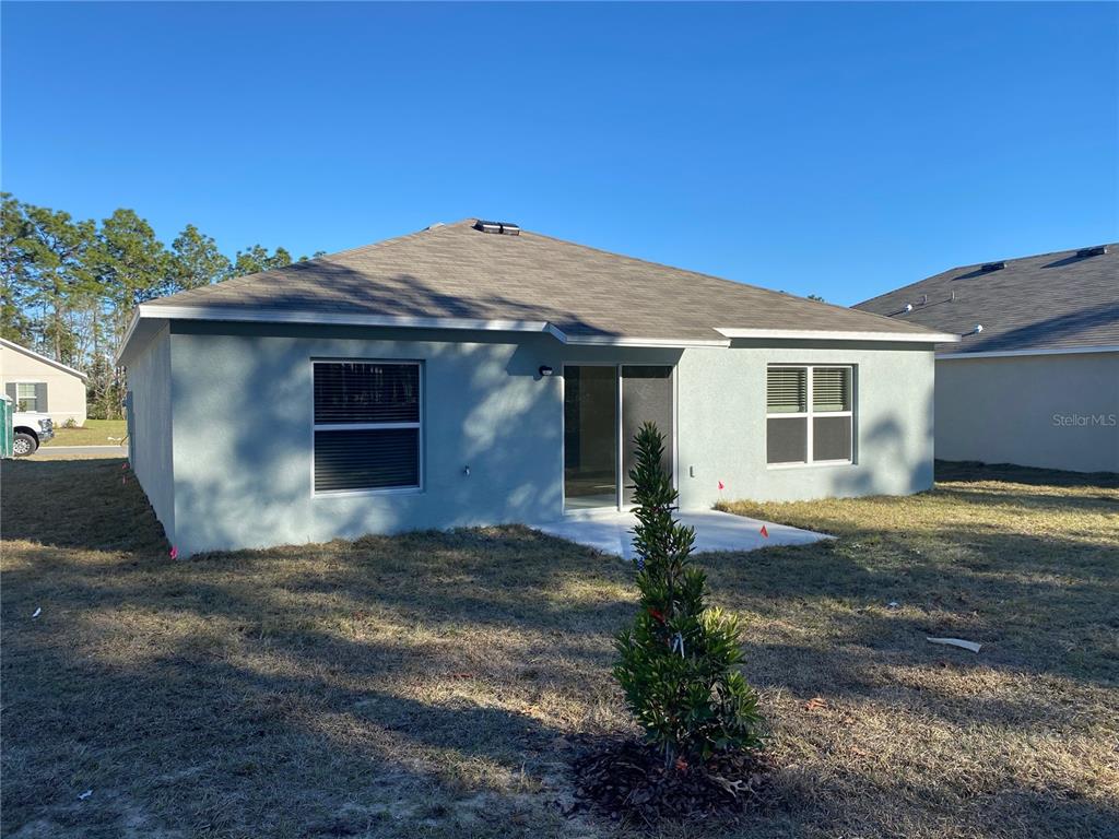 308 Hickory Course Radiel Ocala, FL 34472 - Photo 24 of 24 a front view of a house with garden