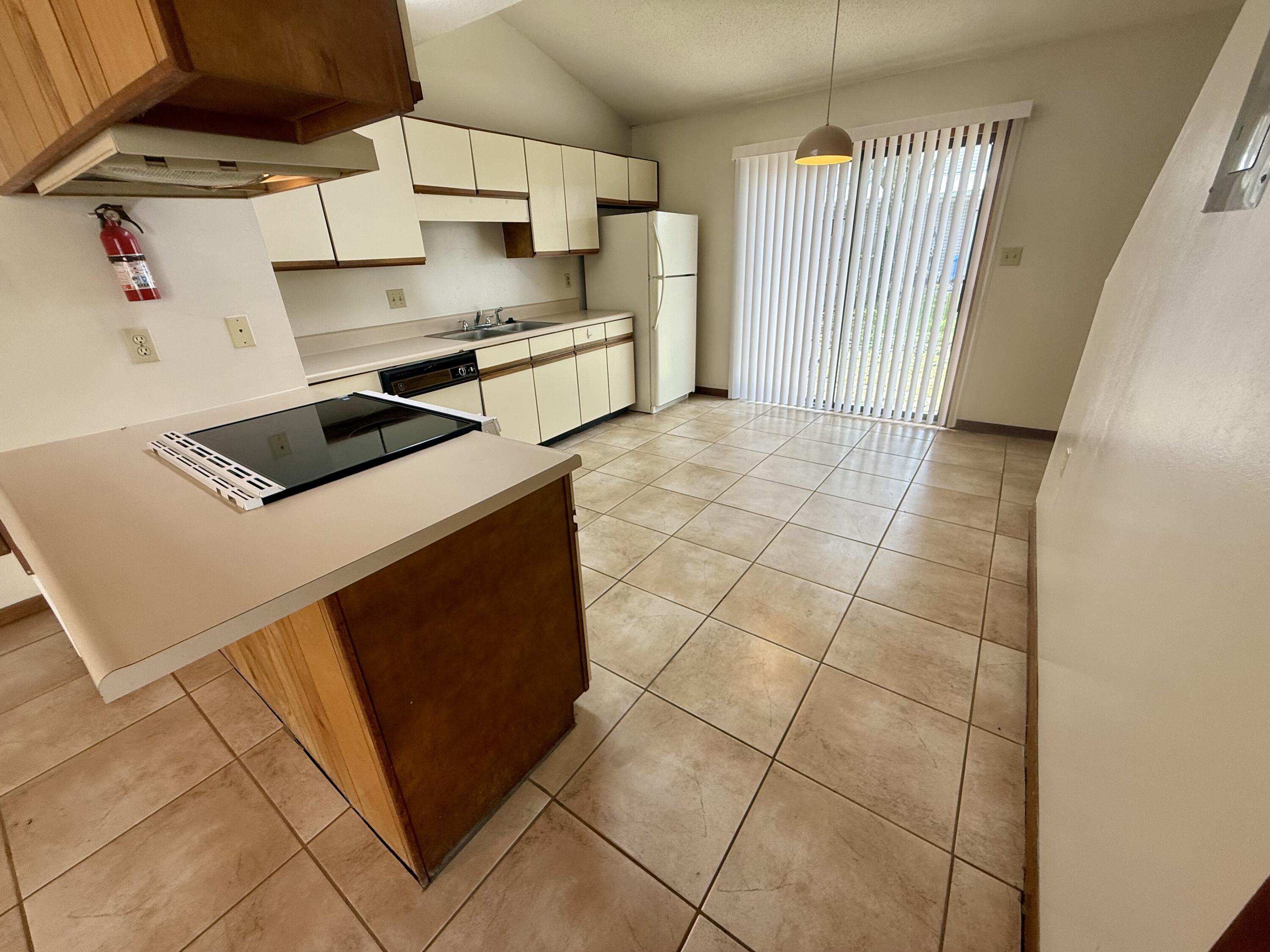 134 Alder Avenue Southeast Fort Walton Beach, FL 32548 - Photo 5 of 15 a kitchen with a cabinets and appliances
