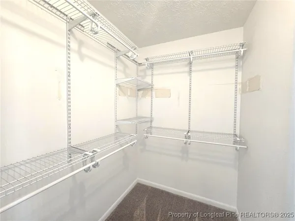 a bathroom with a window and a shower