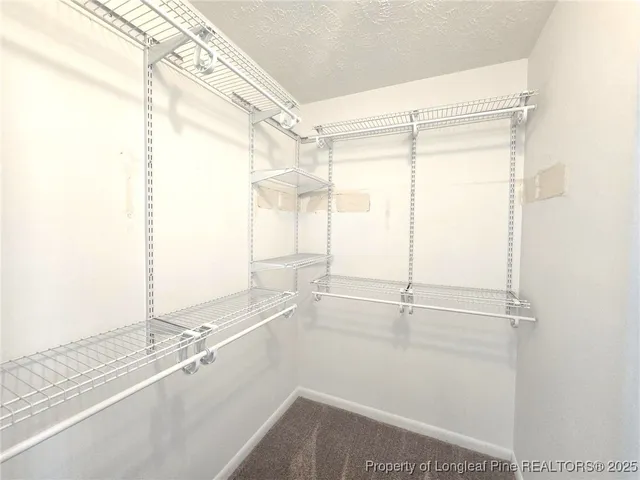 a bathroom with a window and a shower