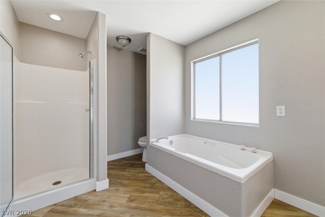 2780 West Simkins Road Pahrump, NV 89060 - Photo 26 of 40 Relax in the deep soaking tub or enjoy the spacious shower in this well-appointed bath.