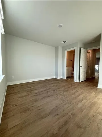 a bathroom with a sink toilet vanity and shower