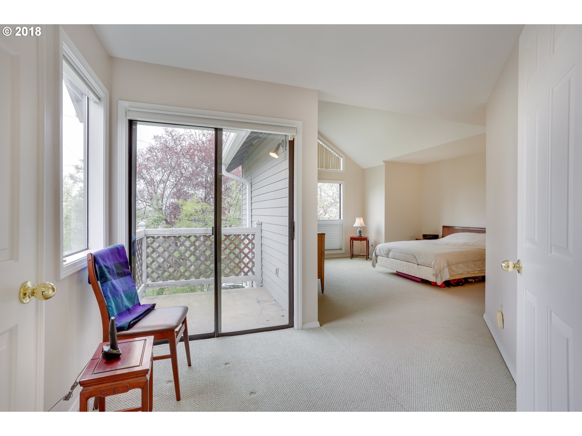 5209 Southwest View Point Terrace Portland, OR 97239 - Photo 12 of 32 a bedroom with furniture and a large window