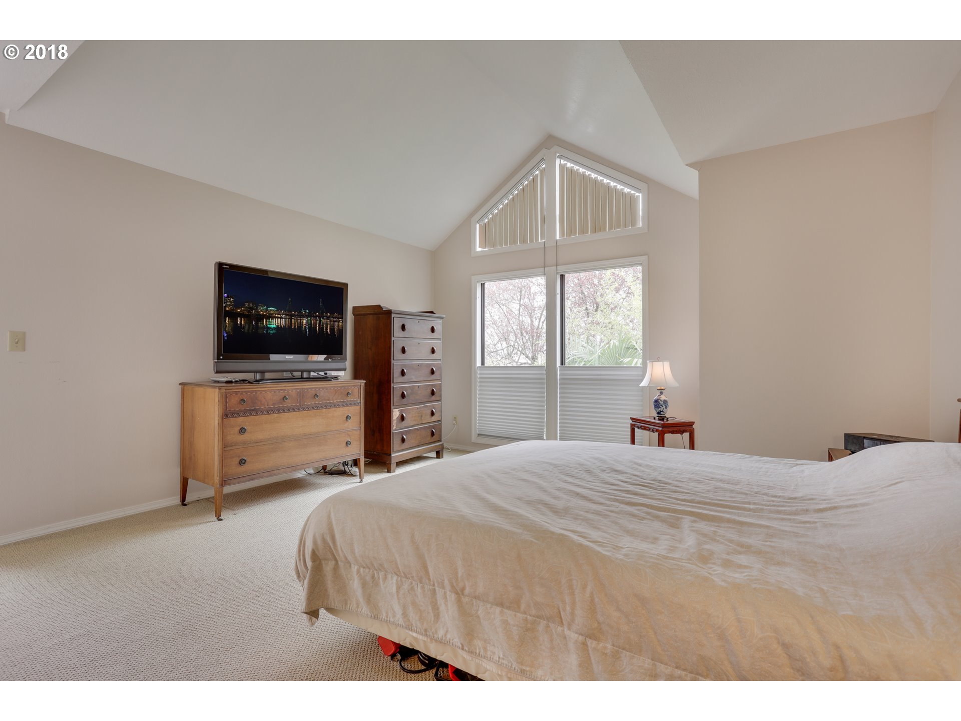 5209 Southwest View Point Terrace Portland, OR 97239 - Photo 15 of 32 a bedroom with a bed and a television