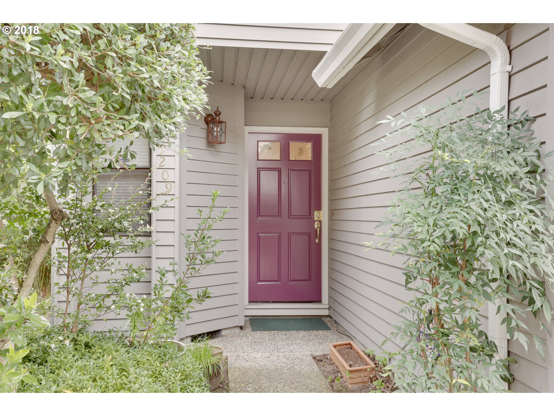 5209 Southwest View Point Terrace Portland, OR 97239 - Photo 2 of 32 a view of house with backyard and garden