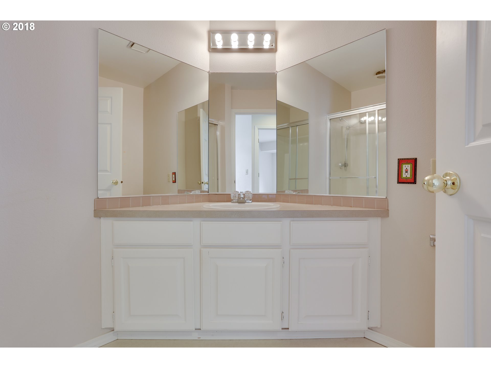 5209 Southwest View Point Terrace Portland, OR 97239 - Photo 21 of 32 a bathroom with a sink and a mirror