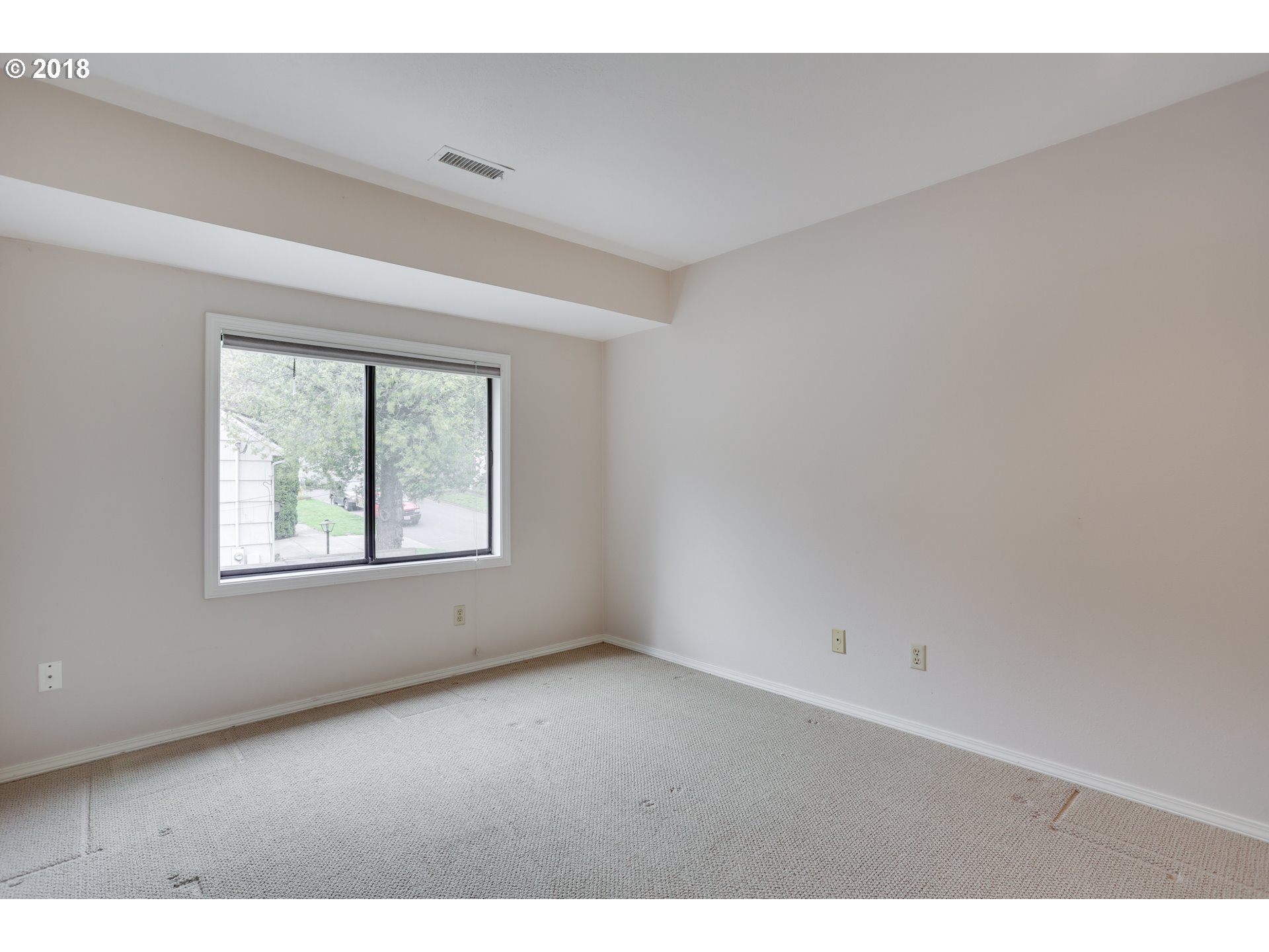 5209 Southwest View Point Terrace Portland, OR 97239 - Photo 22 of 32 a view of an empty room with a window