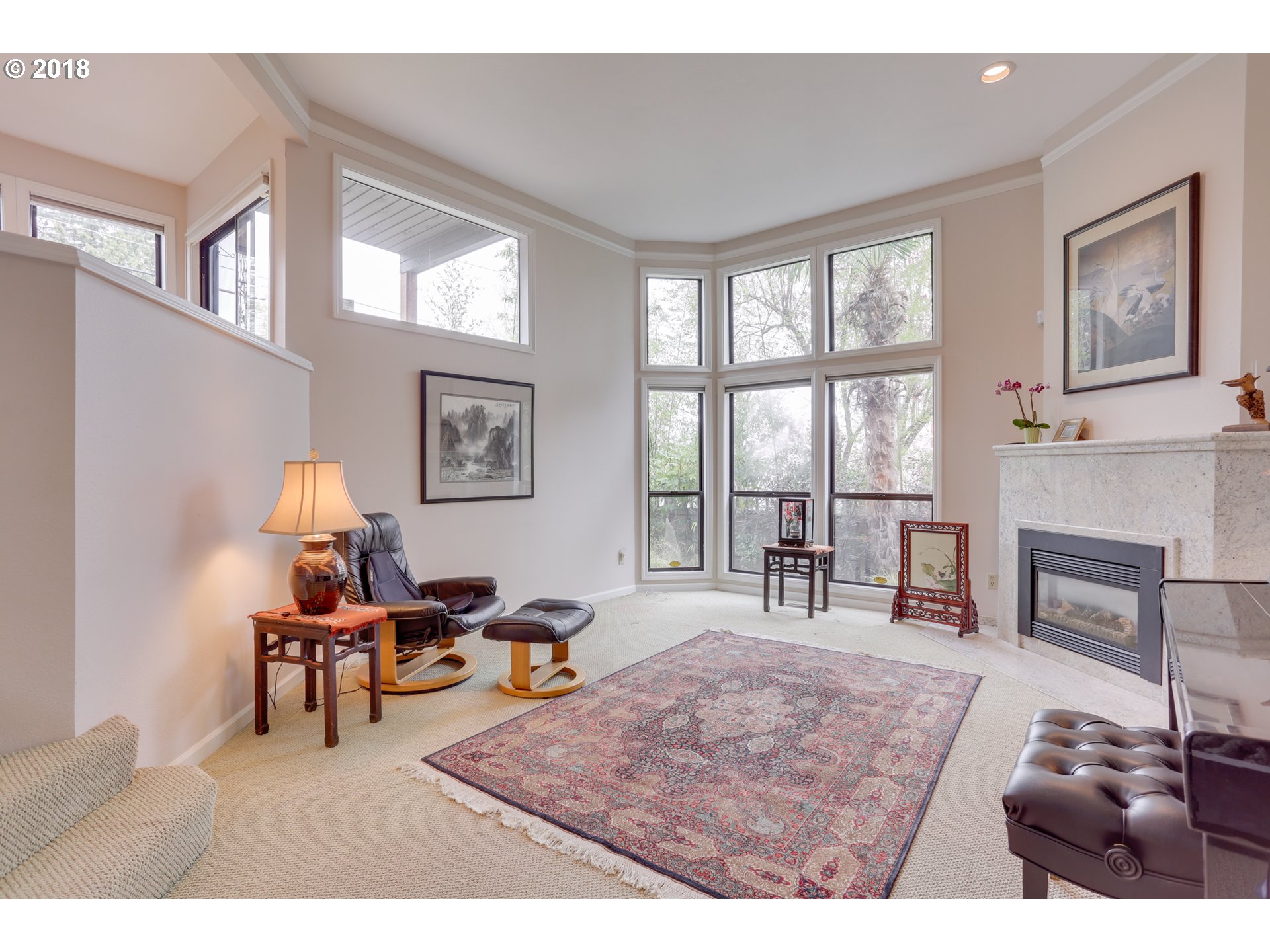 5209 Southwest View Point Terrace Portland, OR 97239 - Photo 5 of 32 a living room with furniture and a fireplace