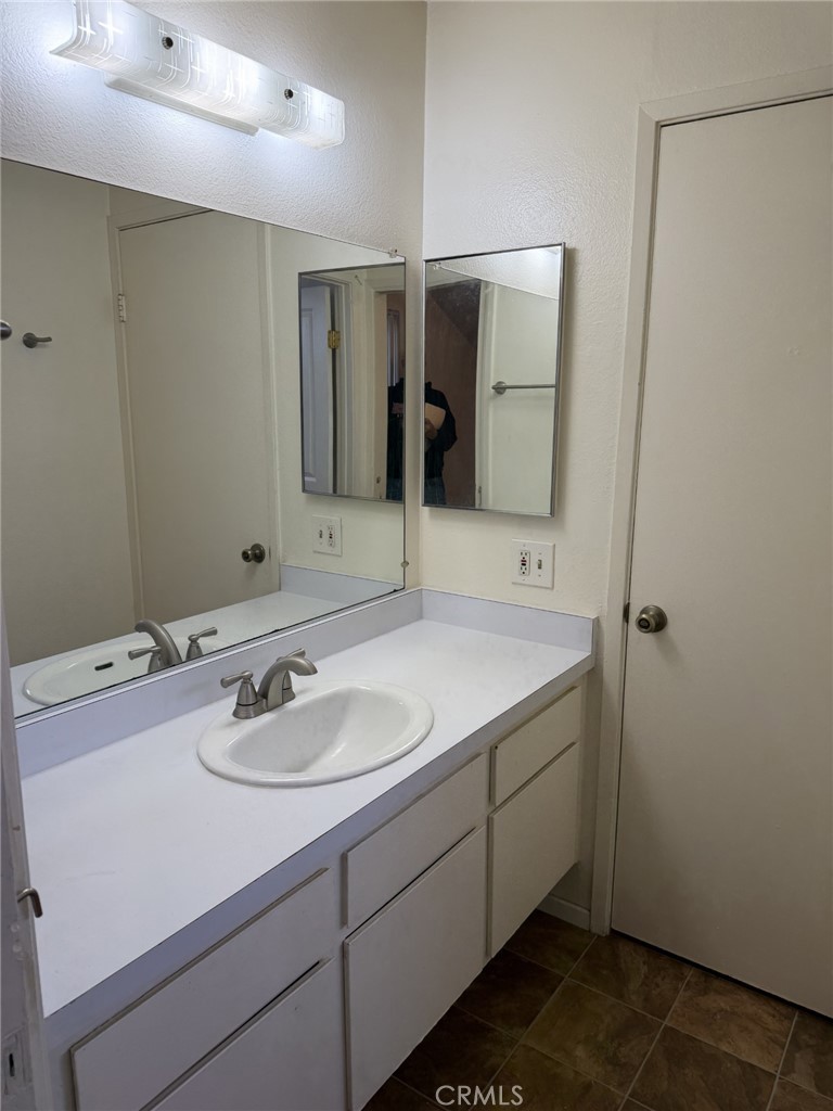 9090 Colony Place, Unit B Riverside, CA 92503 - Photo 11 of 19 a bathroom with a sink and a mirror