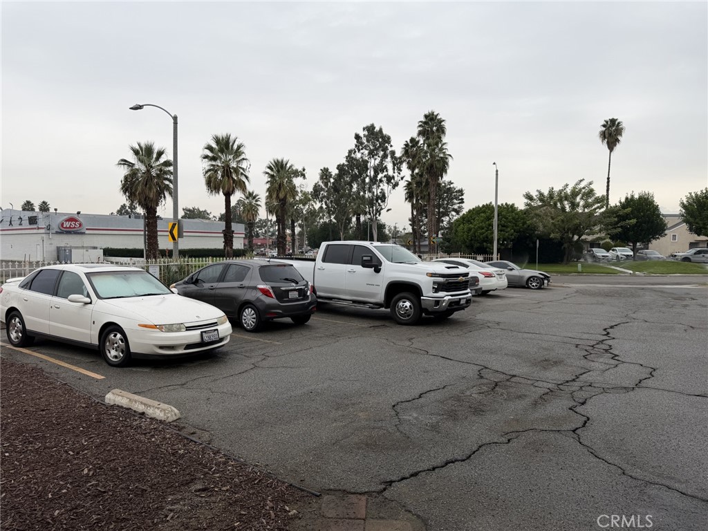 9090 Colony Place, Unit B Riverside, CA 92503 - Photo 18 of 19 a view of cars parked in a parking lot