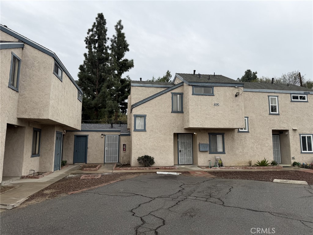 9090 Colony Place, Unit B Riverside, CA 92503 - Photo 19 of 19 a view of a white house with a street