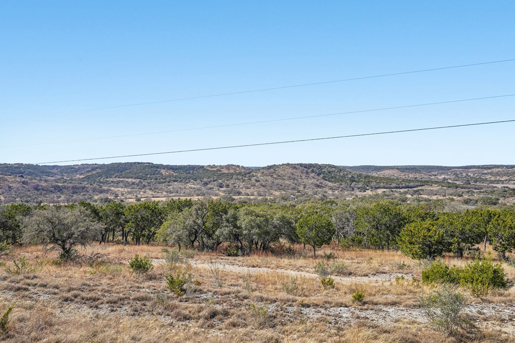 450 South Fork Road East Comfort, TX 78013 - Photo 27 of 36 a view of a lake with mountains in the background