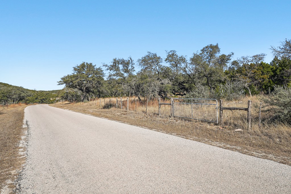 450 South Fork Road East Comfort, TX 78013 - Photo 28 of 36 a view of a dry yard with wooden fence