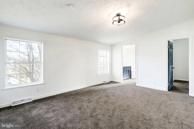 a view of a room with a fan