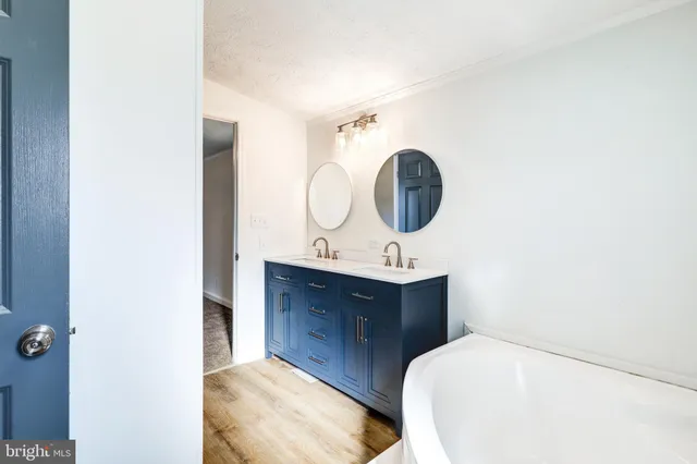 a bathroom with a toilet and a bathtub