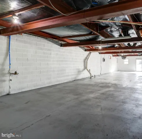 a view of a room with wooden walls and entryway