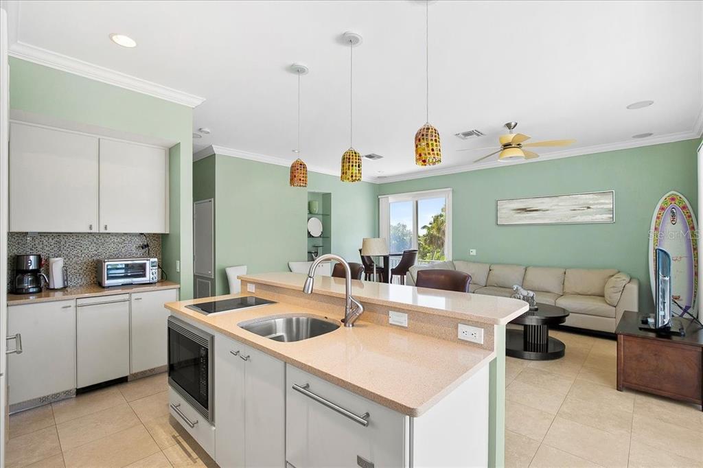 8400 Manasota Key Road Englewood, FL 34223 - Photo 11 of 31 a kitchen that has a sink and a stove