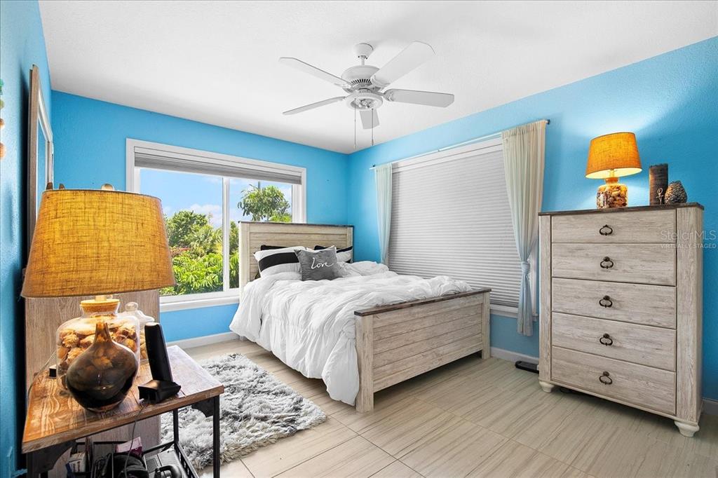 8400 Manasota Key Road Englewood, FL 34223 - Photo 17 of 31 a bedroom with a bed and window