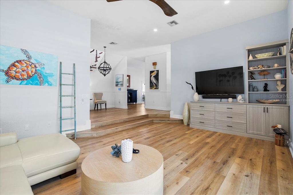8400 Manasota Key Road Englewood, FL 34223 - Photo 22 of 31 a living room with furniture and a flat screen tv