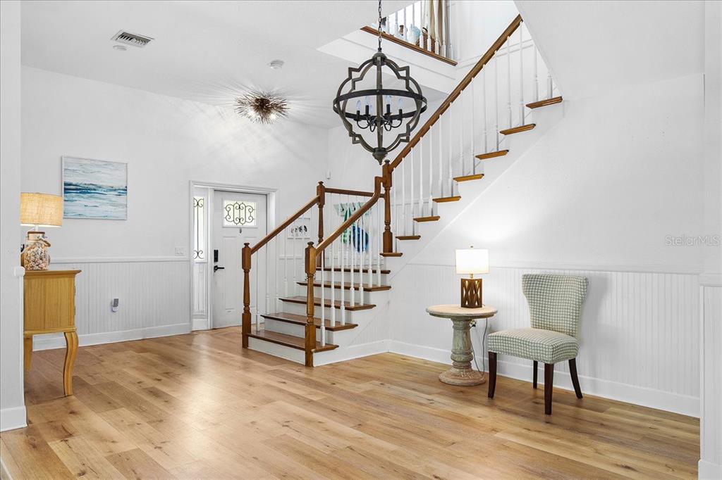 8400 Manasota Key Road Englewood, FL 34223 - Photo 29 of 31 a view of entryway and hall with wooden floor