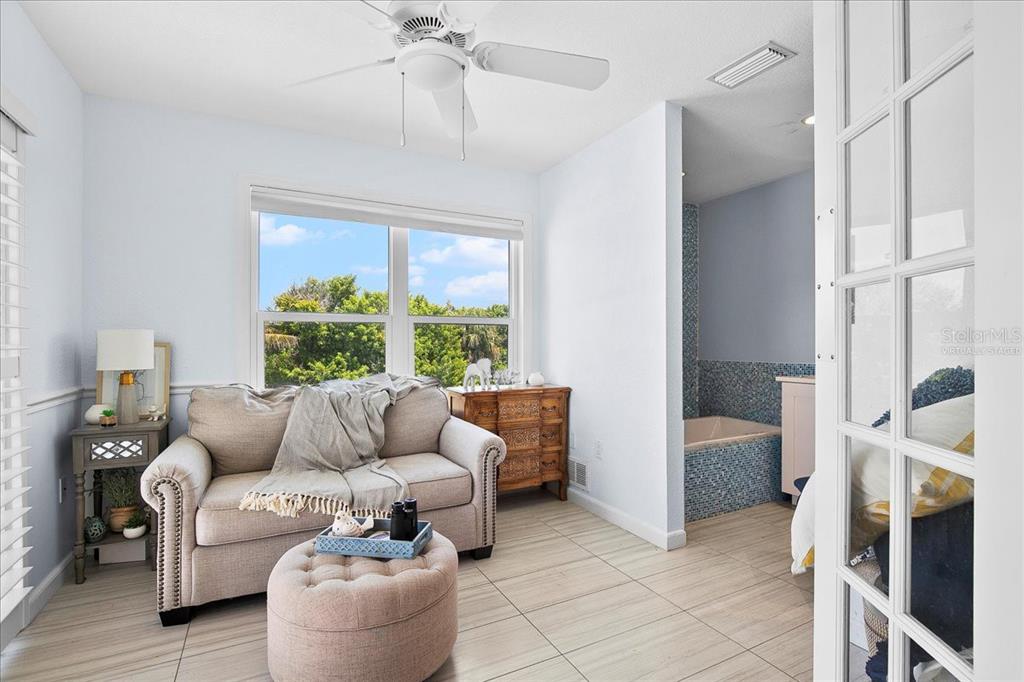 8400 Manasota Key Road Englewood, FL 34223 - Photo 8 of 31 a living room with furniture and a large window