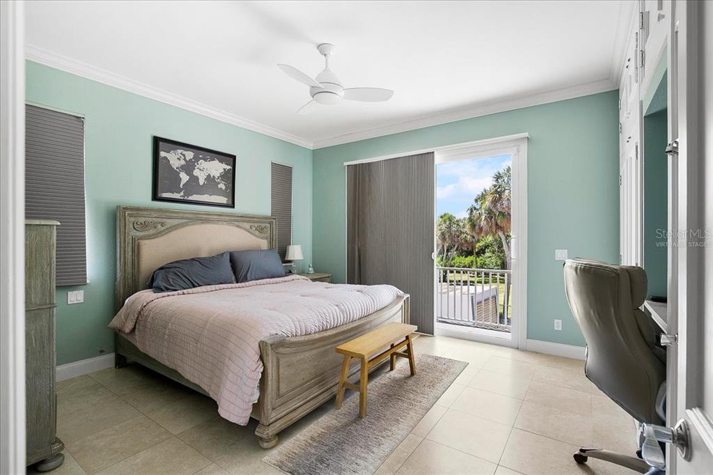 8400 Manasota Key Road Englewood, FL 34223 - Photo 9 of 31 a spacious bedroom with a bed and a large window