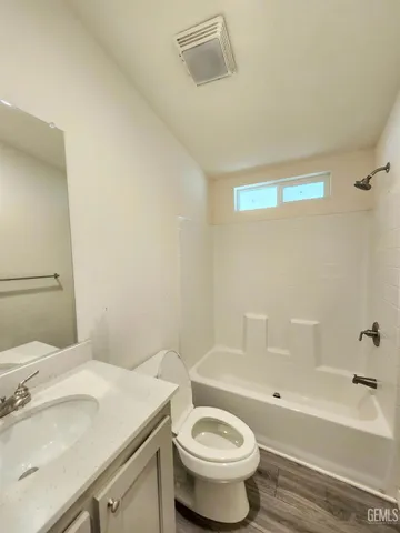 a bathroom with a sink a toilet and a bathtub