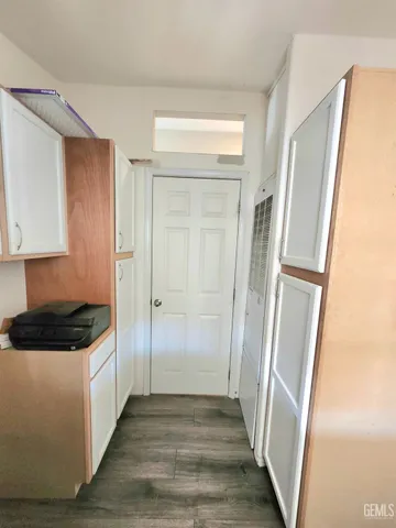 a view of a kitchen from the hallway