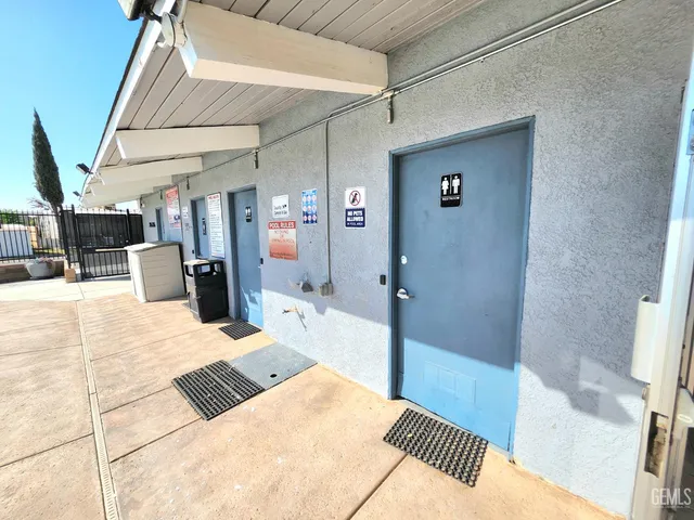 a kitchen with lots of counter space and painting on the wall