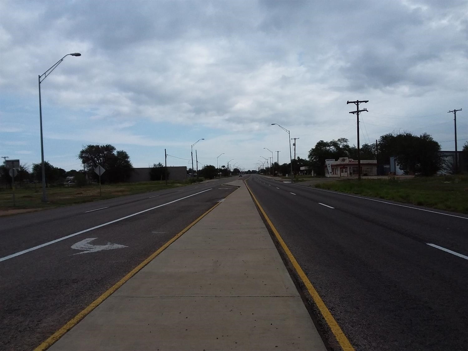 2801 East Broadway Lubbock, TX 79403 - Photo 6 of 6 a view of city street with a car parked on the road