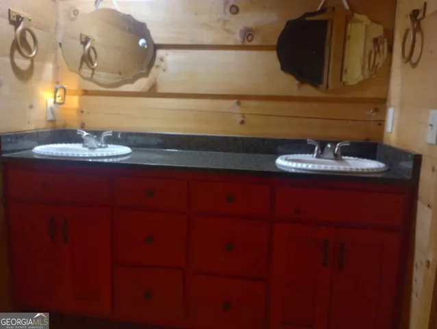 a bathroom with a toilet a sink and bathtub