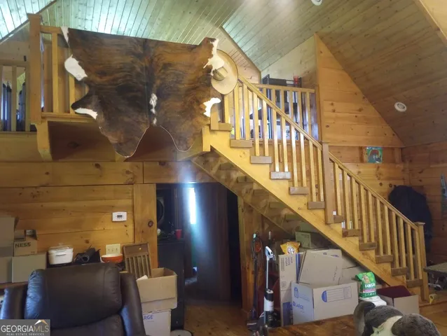 a kitchen with a table chairs and refrigerator