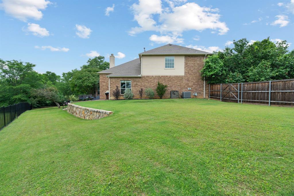 2703 Pottery Trail Corinth, TX 76210 - Photo 35 of 40 a house view with a play ground in front of it