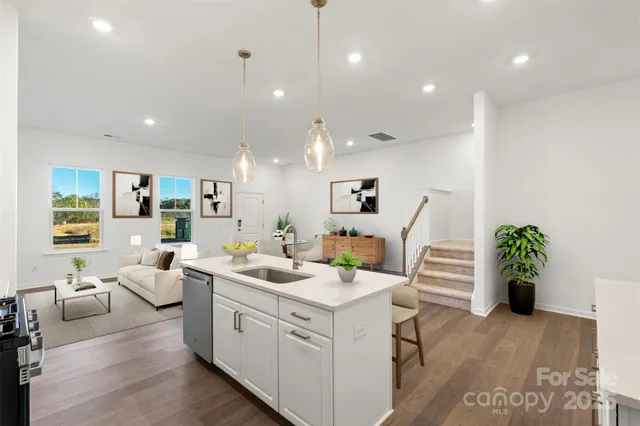 a view of living room with furniture and potted plant