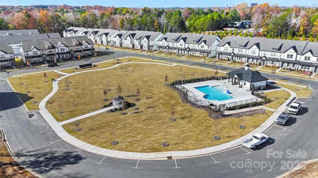 a view of a swimming pool with outdoor seating