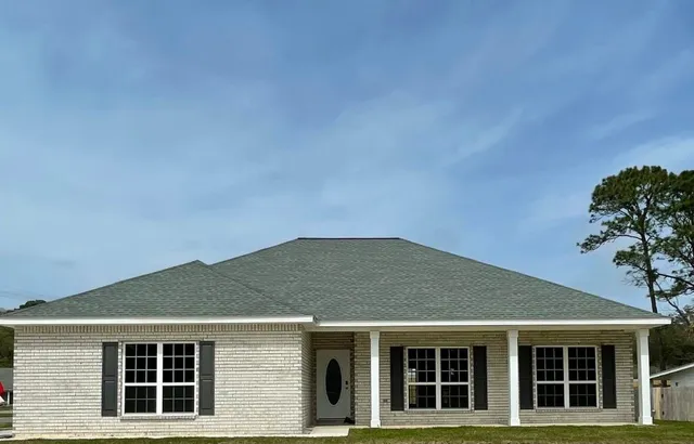 a blue house with a outdoor space