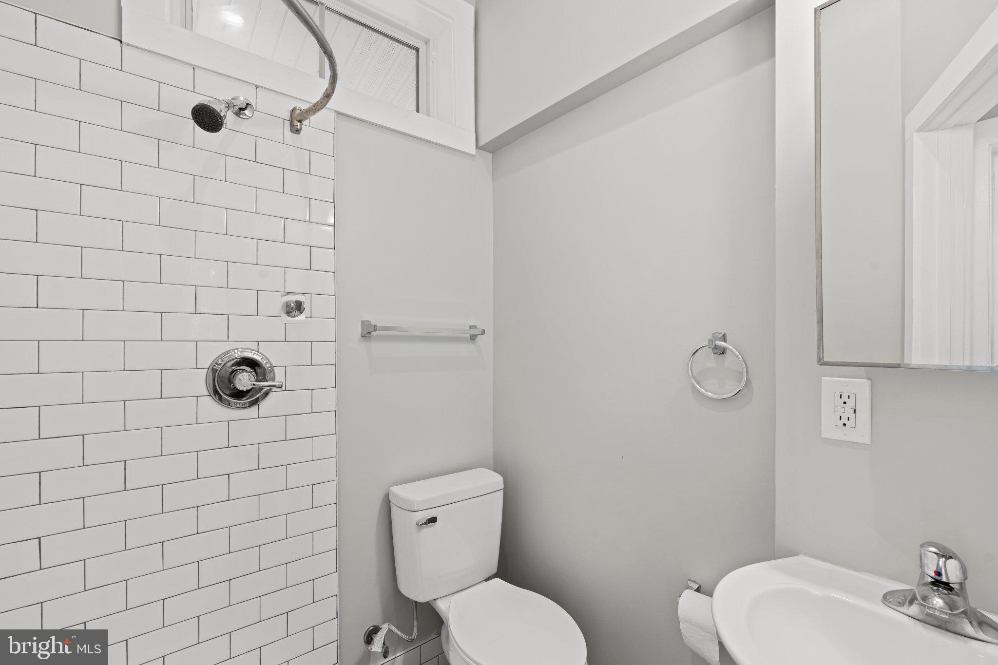 8405 Shirley Road Spotsylvania, VA 22551 - Photo 31 of 42 a bathroom with a toilet and shower