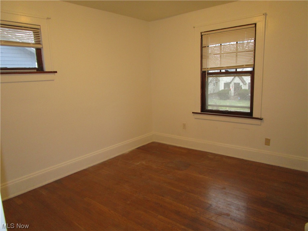 3796 Lowell Road Cleveland Heights, OH 44121 - Photo 7 of 11 Unfurnished room featuring plenty of natural light and dark wood-type flooring