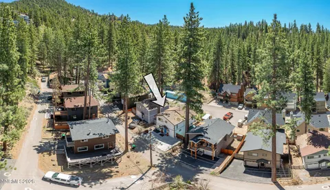 a view of a city with lush green forest