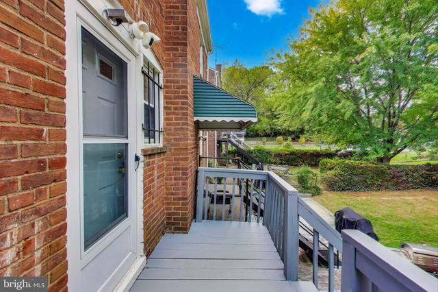 a balcony view with a seating space