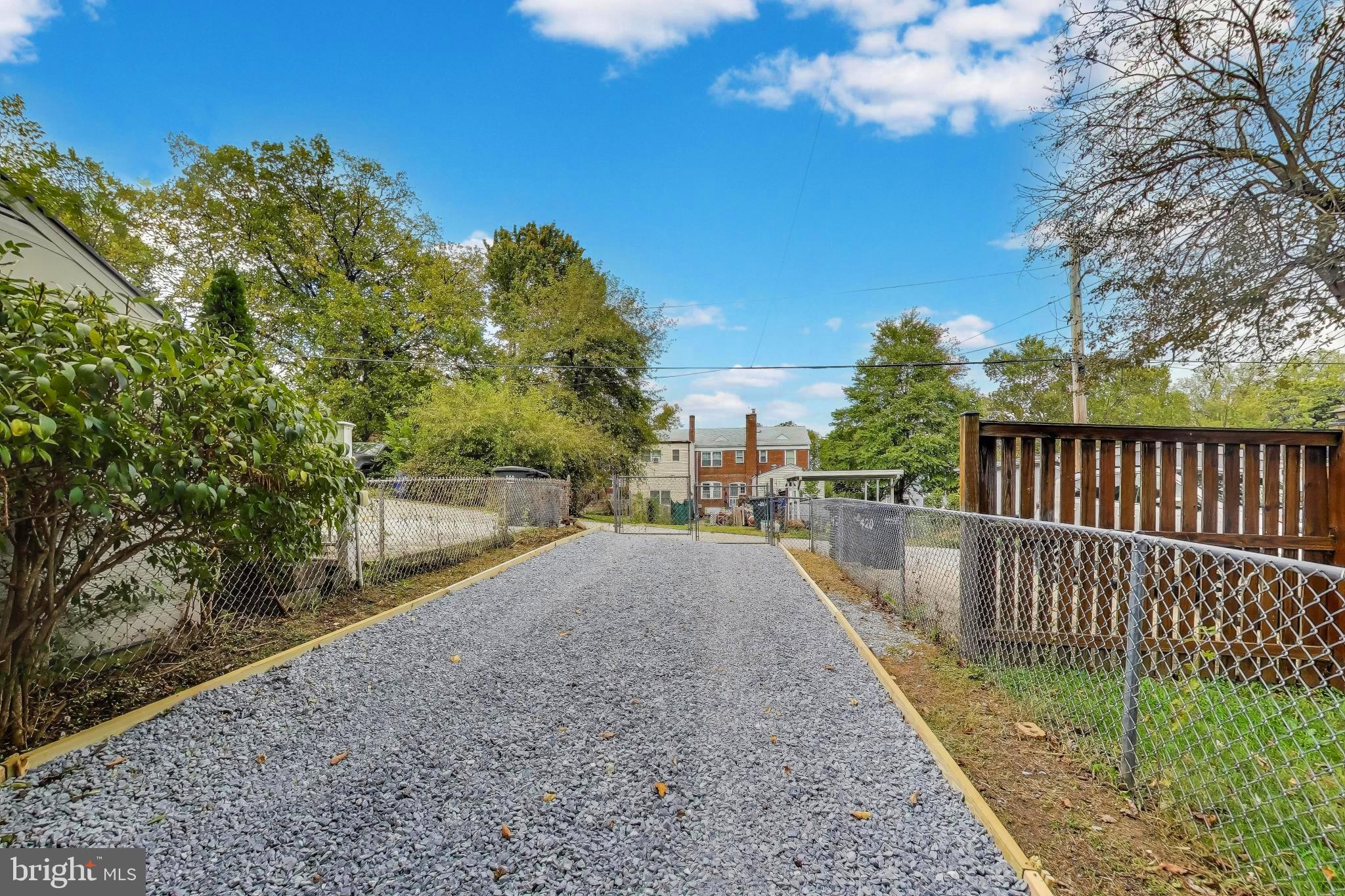 418 Peabody Street Northeast Washington, DC 20011 - Photo 17 of 20 a view of a pathway with a wrought fence